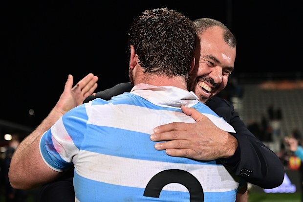 Pumas coach Michael Cheika hugs Julian Montoya.