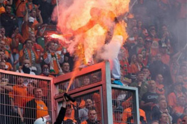 A Polish football fan is engulfed by flames. (supplied)