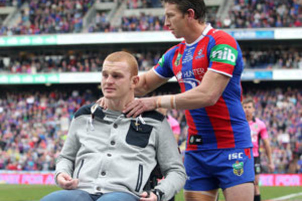 Alex McKinnon with Newcastle captain Kurt Gidlery. (Getty)