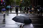 SMH FIRST USE: People walk through Sydney streets, near Martin Place Station, as rain falls in the morning. Sydney faces heavy rainfall throughout the end of the week and into the weekend. Friday, February 27th, 2026. Photo: Audrey Richardson, The Sydney Morning Herald.