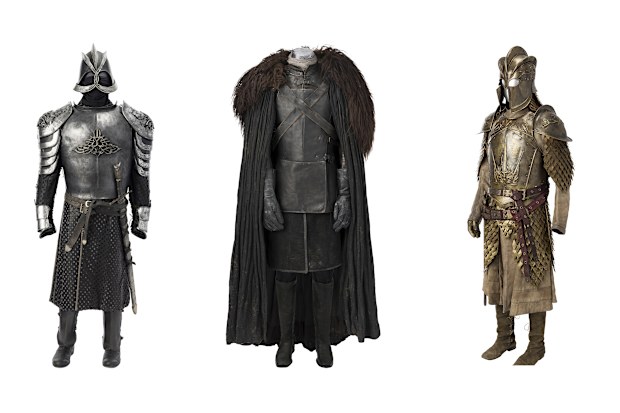 Costumes worn by characters from Game of Thrones, from left, armour worn by Gregor "The Mountain" Clegane, Jon Snow's Night's Watch ensemble, and Jaime Lannister's full Kingsguard armour. 
