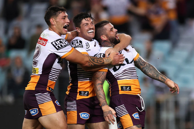 Adam Reynolds of the Broncos celebrates scoring a try against South Sydney.