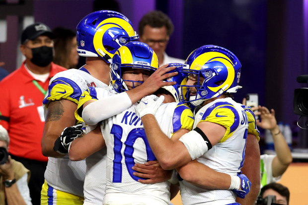 Cooper Kupp #10 of the Los Angeles Rams reacts with Matthew Stafford #9 following a touchdown reception during the fourth quarter of Super Bowl LVI against the Cincinnati Bengals at SoFi Stadium on February 13, 2022 in Inglewood, California. (Photo by Rob Carr/Getty Images)