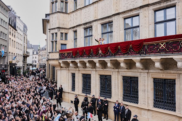 Luxembourg's Grand Duke Guillaume and Luxembourg's Grand Duchess Stephanie wave from the balcony of the Grand Ducal Palace in Luxembourg, Friday, Oct. 3, 2025. (AP Photo/Omar Havana)