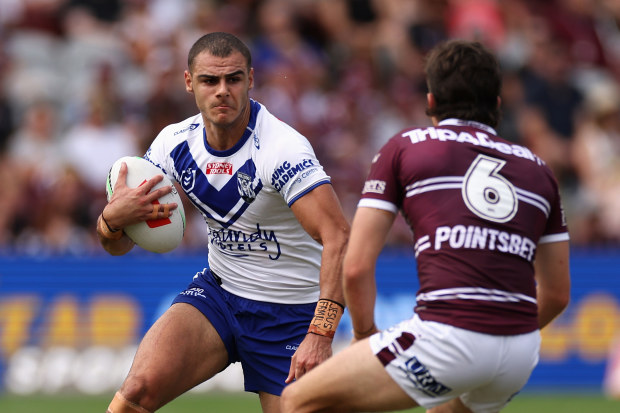 SYDNEY, AUSTRALIA - MARCH 04: Jacob Kiraz of the Bulldogs is tackled during the round one NRL match between the Manly Sea Eagles and the Canterbury Bulldogs at 4 Pines Park on March 04, 2023 in Sydney, Australia. (Photo by Cameron Spencer/Getty Images)