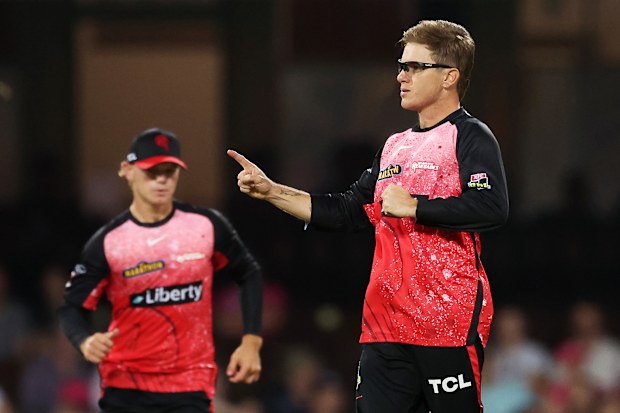 Adam Zampa of the Renegades celebrates with teammates after taking the wicket of Tom Curran of the Sixers.