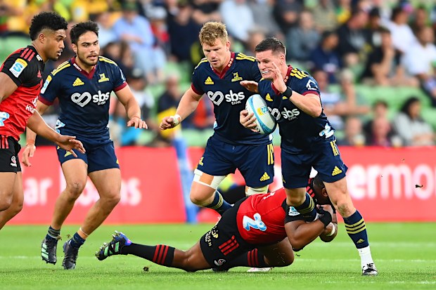 Freddie Burns (right) in action for the Highlanders during their Super Round match against the Crusaders.