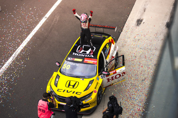 Tony D'Alberto stands atop his car ater winning the TCR Australia Series.
