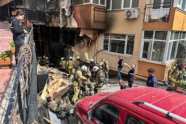 Firefighters work after a fire broke out at a nightclub in Istanbul, Turkey, Tuesday, April 2, 2024