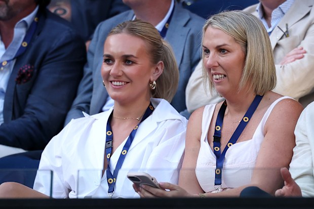 Ariarne Titmus (left) watching on at the 2025 Australian Open.