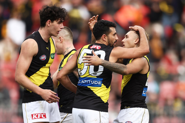 SYDNEY, AUSTRALIA - JUNE 04:  Marlion Pickett of the Tigers celebrates with team mates after kicking the fianl goal during the round 12 AFL match between Greater Western Sydney Giants and Richmond Tigers at GIANTS Stadium, on June 04, 2023, in Sydney, Australia. (Photo by Matt King/AFL Photos/via Getty Images )