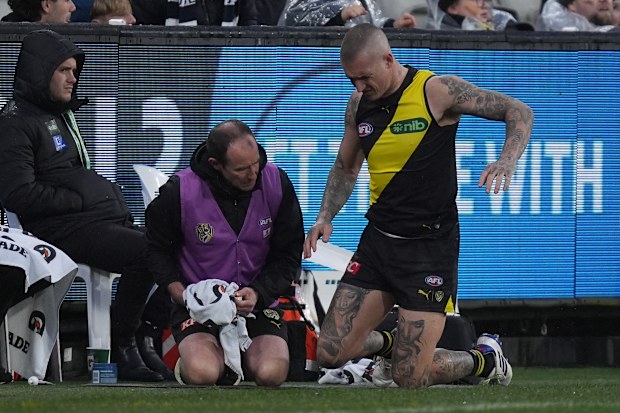 Dustin Martin was in agony as he received treatment on his back.