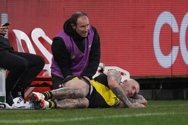 Dustin Martin was in agony as he received treatment on his back.
