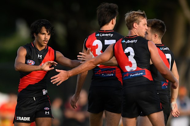 GOLD COAST, AUSTRALIA - FEBRUARY 23: Alwyn Davey of the Saints celebrates kicking a goal with team mates during the AFL match simulation between Gold Coast Suns and Essendon Bombers at Austworld Centre Oval on February 23, 2023 in Gold Coast, Australia. (Photo by Matt Roberts/Getty Images)