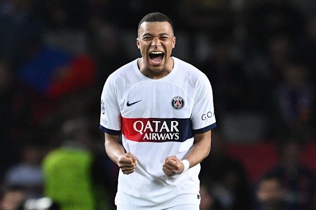 Kylian Mbappe of Paris Saint-Germain celebrates victory in the UEFA Champions League quarter-final second leg match between FC Barcelona and Paris Saint-Germain at Estadi Olimpic Lluis Companys.