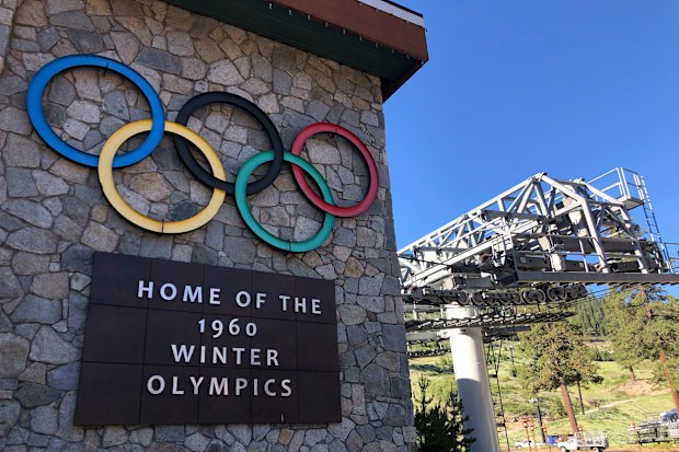 A sign marking the 1960 Winter Olympics is seen by a chairlift at Squaw Valley Ski Resort in Olympic Valley.