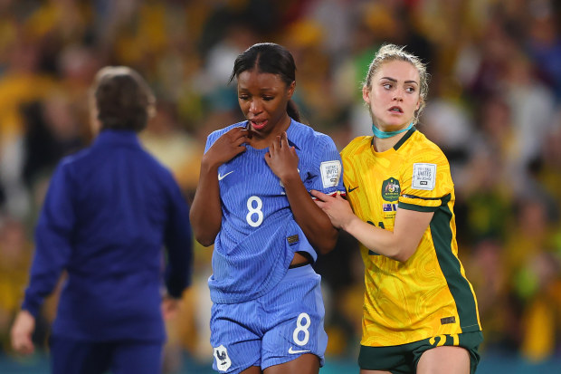 Grace Geyoro of France is consoled by Ellie Carpenter of Australia.