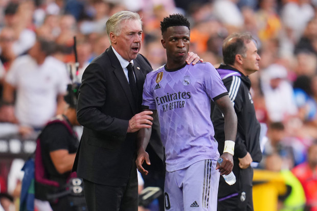 VALENCIA, SPAIN - MAY 21: Carlo Ancelotti, Head Coach of Real Madrid, interacts with Vinicius Junior of Real Madrid during the LaLiga Santander match between Valencia CF and Real Madrid CF at Estadio Mestalla on May 21, 2023 in Valencia, Spain. (Photo by Aitor Alcalde/Getty Images)