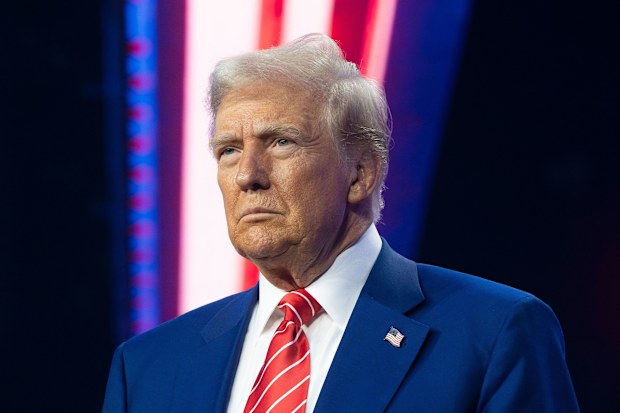 President-elect Donald Trump looks on during Turning Point USA's AmericaFest at the Phoenix Convention Center on December 22, 2024. 