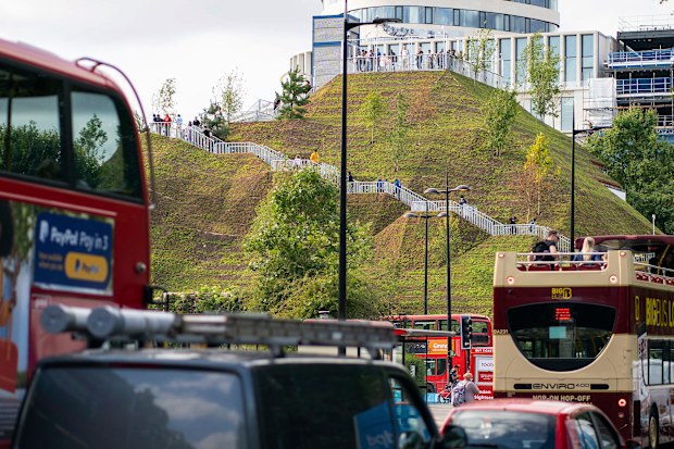 General view of traffic on Park Lane, and the Marble Arch Mound in central London, a 25-metre high installation built to provide members of the public with sweeping views of Hyde Park, Mayfair and Marylebone. The deputy leader of Westminster council has resigned after the total costs for the mound nearly doubled to £6 million. Picture date: Friday August 13, 2021. PA Photo. The artificial hill, built on a scaffolding base with layers of soil and plywood forming the mound, opened to the public la