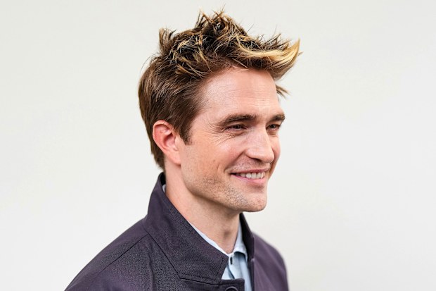 Robert Pattinson attended the Dior Homme Menswear Spring/Summer 2025 runway presentation in Paris on June 21 and was captured in a video posted to social media talking about how he was only in town for a quick visit but had to "get back for the baby." 	**This image is for use with this specific article only** 