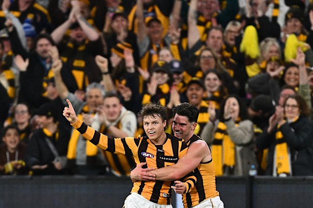 Jack Ginnivan of the Hawks celebrates kicking a goal.