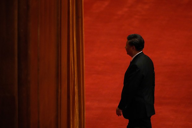 Chinese President Xi Jinping leaves after delivering a speech at an event commemorating the 110th anniversary of Xinhai Revolution at the Great Hall of the People in Beijing. (AP 