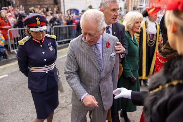 King Charles III reacts after an egg was thrown his direction as he arrived for a ceremony at Micklegate Bar, where the Sovereign is traditionally welcomed to the city, in York, England, Wednesday Nov. 9, 2022 