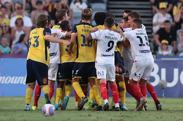 Players tussle during the A-League match between Central Coast Mariners and Melbourne City.