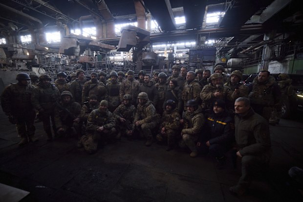 Ukrainian President Volodymyr Zelenskyy, centre, poses for photo with soldiers at the site of the heaviest battles with the Russian invaders in Bakhmut, Ukraine, Tuesday, Dec. 20, 2022. 