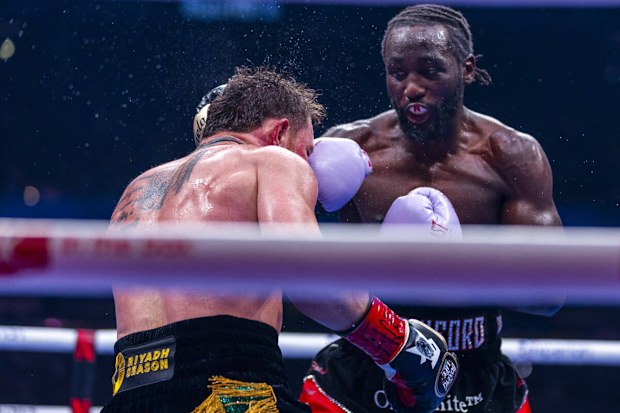 Canelo Alvarez takes a punch to the face from Terence Crawford during their undisputed super middleweight championship fight 