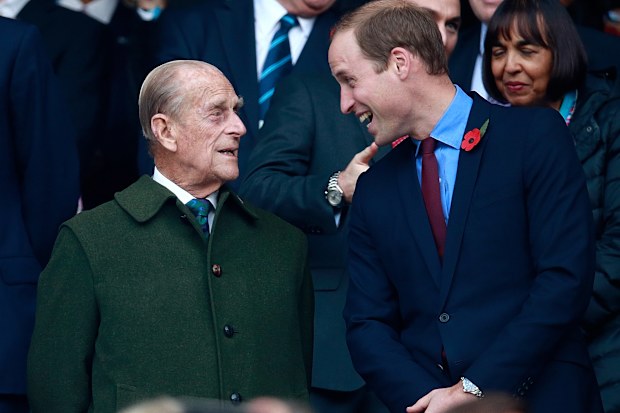 Prince Harry, Prince Phillip and Prince William enjoy the build up to the 2015 Rugby World Cup Final match between New Zealand and Australia at Twickenham Stadium on October 31, 2015 in London
