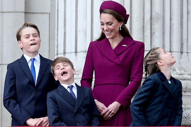 Prince George of Wales, Prince Louis of Wales, Catherine, Princess of Wales and Princess Charlotte of Wales watch the fly-past on the balcony of Buckingham Palace whilst watching a fly-past during the military procession to mark the 80th anniversary of VE Day on May 05, 2025 in London, England. 