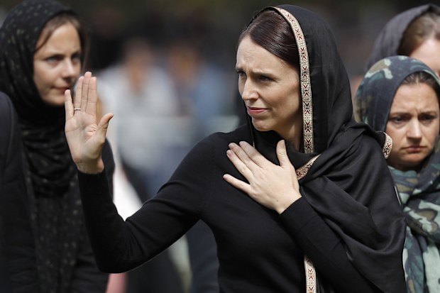 New Zealand Prime Minister Jacinda Ardern waves as she leaves Friday prayers at Hagley Park in Christchurch, New Zealand. Ardern was hailed around the world for her decisive response to the two mosque shootings by a white nationalist who killed 50 worshippers in Christchurch mosques on 15 March 2019. Community leaders and researchers say that for too long, terrorism was considered a "Muslim problem" and that a double standard persists when attacker is white and non-Muslim.