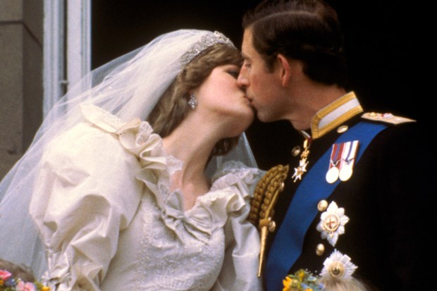 FILE - In this July 29, 1981 file photo, Britain's Prince Charles kisses his bride, Princess Diana, on the balcony of Buckingham Palace in London, after their wedding. Prince Charles has been preparing for the crown his entire life. Now, that moment has finally arrived. Charles, the oldest person to ever assume the British throne, became king on Thursday Sept. 8, 2022, following the death of his mother, Queen Elizabeth II. (AP Photo, File)