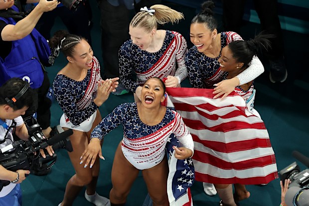 Hezly Rivera, Jordan Chiles, Jade Carey, Sunisa Lee and Simone Biles of Team United States celebrate winning the gold medals after the Artistic Gymnastics.