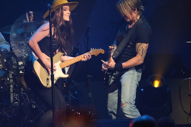 AUSTIN, TEXAS - MAY 04: (L-R) Maggie Baugh and Keith Urban perform onstage at the 2024 iHeartCountry Festival - Show at Moody Center on May 04, 2024 in Austin, Texas. (Photo by Hubert Vestil/WireImage)