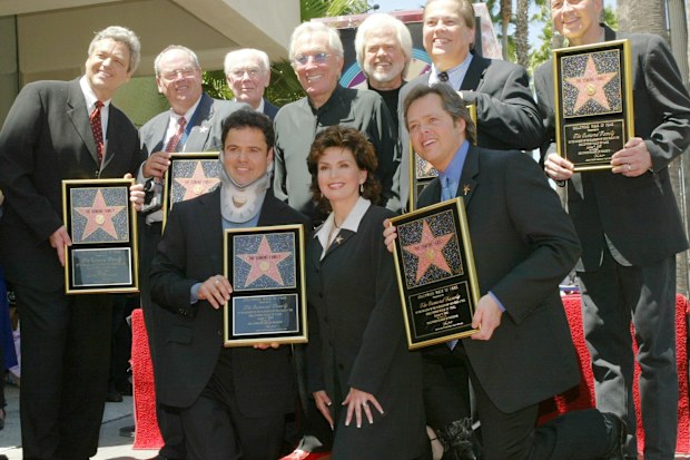 Jay, Tom, family patriarch George, singer Andy Williams, Merrill, Allan and Wayne Osmond.