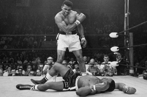 Muhammad Ali standing over Sonny Liston in his 1964 world title victory.