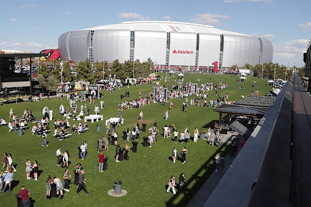 GLENDALE, ARIZONA - MARCH 17: Fans arrive at State Farm Stadium for the opening night of Taylor Swift's "The Eras" Tour on March 17, 2023 in Glendale, Arizona. (Photo by John Medina/Getty Images)