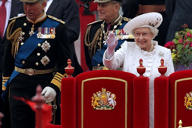 (L-R) Prince Charles, Prince of Wales, Prince Philip, Duke of Edinburgh and Queen Elizabeth II wave from the Spirit of Chartwell during the Diamond Jubilee Thames River Pageant on June 3, 2012 in London