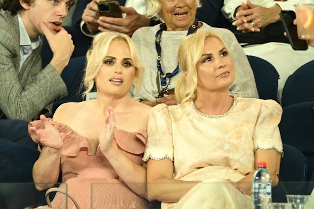 MELBOURNE, AUSTRALIA - JANUARY 12: Rebel Wilson and wife Ramona Agruma watch the Men's Singles First Round match between Alexander Zverev of Germany and Lucas Pouille of France during day one of the 2025 Australian Open at Melbourne Park on January 12, 2025 in Melbourne, Australia. (Photo by Hannah Peters/Getty Images)