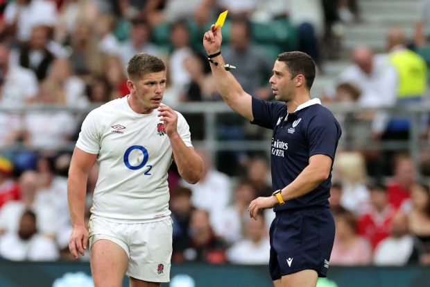 Nika Amashukeli, the referee, shows Owen Farrell a yellow card which was later upgraded to red after a TMO review.