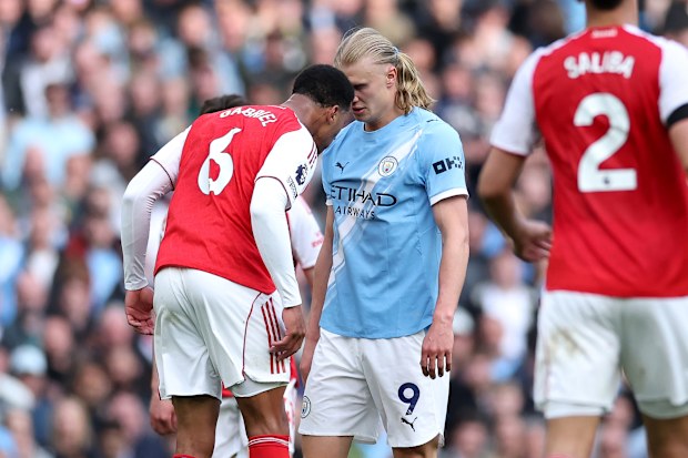 Gabriel of Arsenal clashes with Erling Haaland of Manchester City.