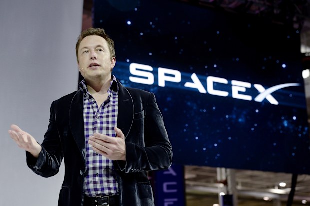 HAWTHORNE-CA-MAY 29: SpaceX CEO Elon Musk unveils the company's new manned spacecraft, The Dragon V2, designed to carry astronauts into space during a news conference on May 29, 2014, in Hawthorne, California. The private spaceflight company has been flying unmanned capsules to the Space Station delivering cargo for the past two years. The Dragon V2 manned spacecraft will ferry up to seven astronauts to low-Earth orbit. (Photo by Kevork Djansezian/Getty Images)