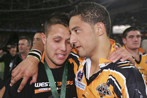 Scott Prince and Benji Marshall celebrate the Wests Tigers' 2005 premiership win.
