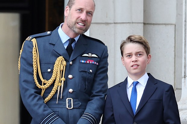 Prince William, Prince of Wales and Prince George of Wales during the fly-past on Buckingham Palace balcony to mark the 80th anniversary of VE Day on May 05, 2025 in London, England. 