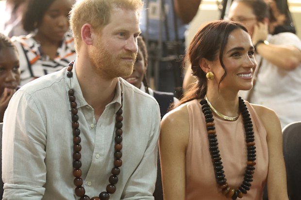 ABUJA, NIGERIA - MAY 10: Duke of Sussex Prince Harry (L) his wife Meghan Markle (R), Duchess of Sussex, visit the Lightway Academy in Abuja, Nigeria as part of celebrations of Invictus Games anniversary on May 10, 2024. (Photo by Emmanuel Osodi/Anadolu via Getty Images)