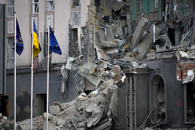 A damaged hotel at the scene of Russian shelling in Kyiv, Ukraine, Saturday, Dec. 31, 2022.
