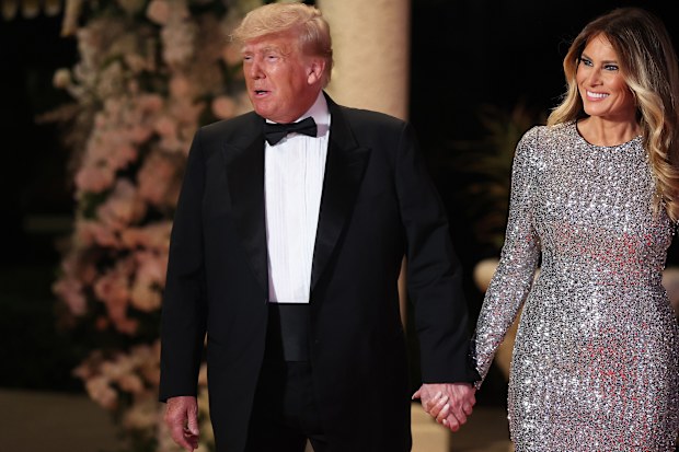 PALM BEACH, FLORIDA - DECEMBER 31: Former U.S. President Donald Trump and former first lady Melania Trump arrive for a New Years event at his Mar-a-Lago home on December 31, 2022 in Palm Beach, Florida. Trump continues to run for a second term as the President of the United States. (Photo by Joe Raedle/Getty Images)